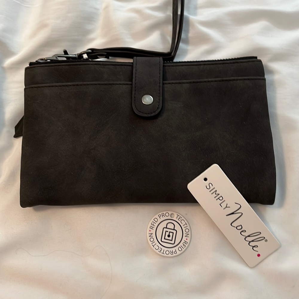 Noelle bi-fold portfolio style wallet with wristlet strap.